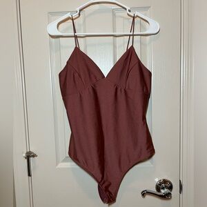 Dusty Rose spaghetti strap body suit. Size L. 82% Nylon 8% Polyester
